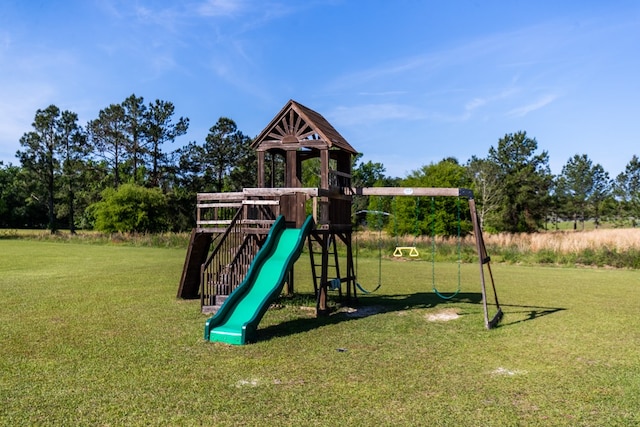 view of playground with a lawn