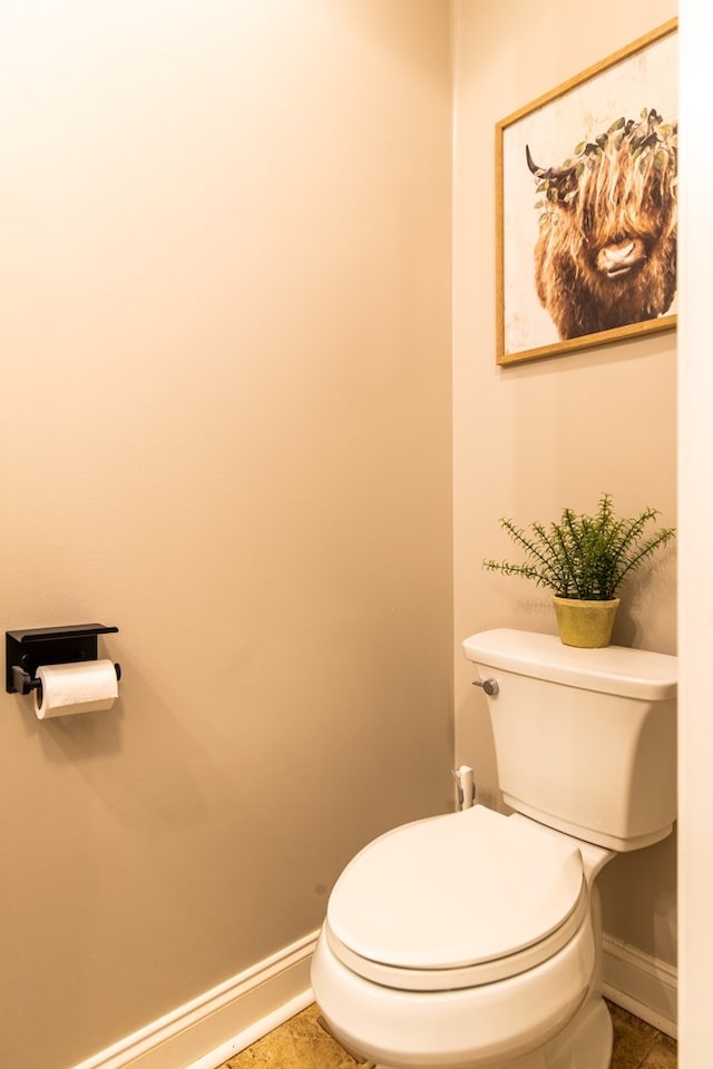 bathroom featuring tile patterned floors and toilet