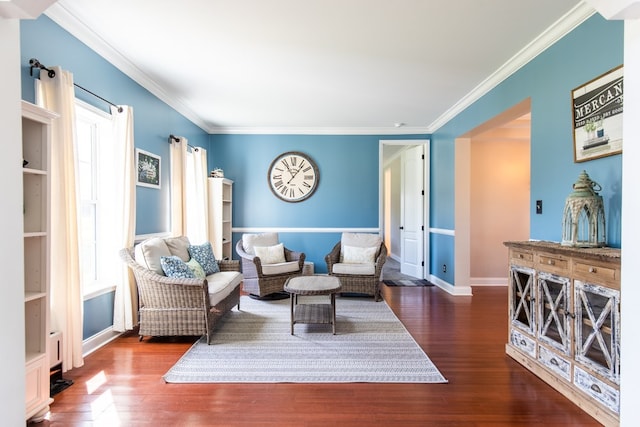 living room with dark hardwood / wood-style flooring and crown molding