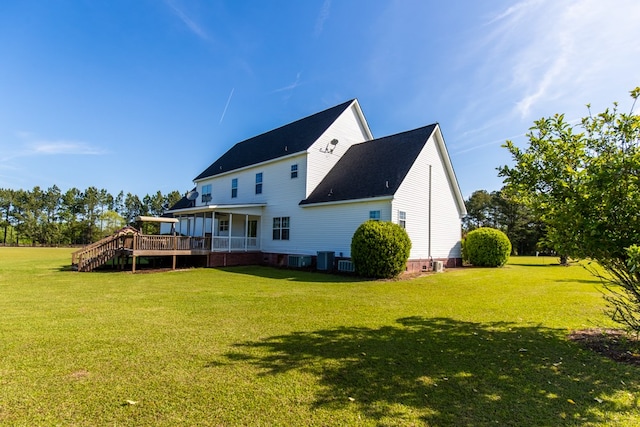 back of house with a wooden deck, a yard, and central AC unit