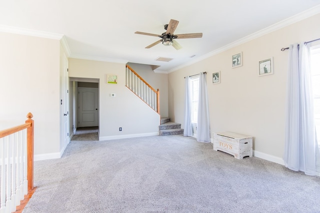 carpeted empty room featuring ceiling fan and ornamental molding