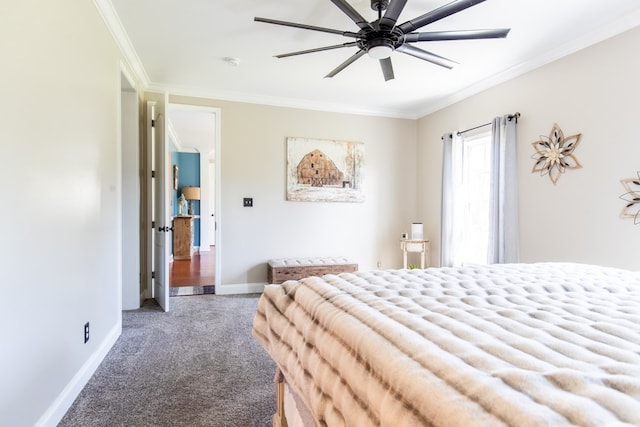 carpeted bedroom featuring ceiling fan and crown molding