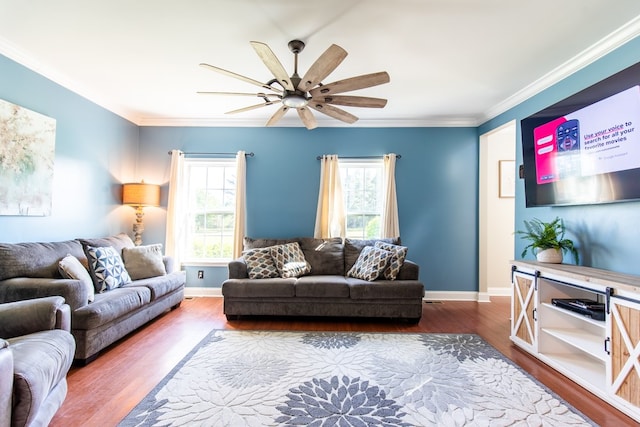 living room featuring hardwood / wood-style floors, ceiling fan, and crown molding