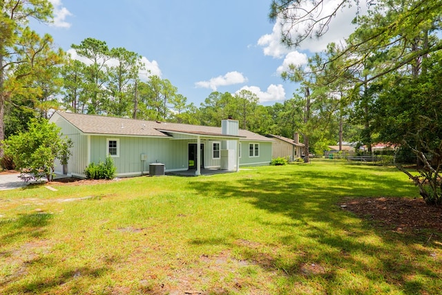 2019 Falling Leaf Ln, Valdosta, GA 31602 - back of house featuring a chimney and a patio area