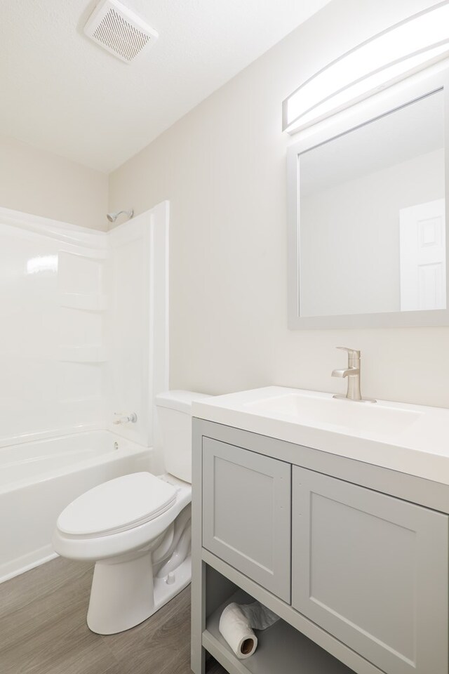 2019 Falling Leaf Ln, Valdosta, GA 31602 - bathroom with vanity, wood finished floors, and shower / tub combination