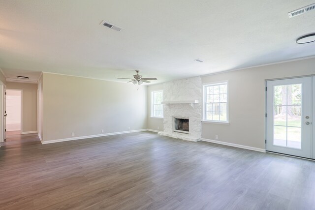 2019 Falling Leaf Ln, Valdosta, GA 31602 - unfurnished living room featuring wood finished floors, a fireplace, a ceiling fan, and ornamental molding