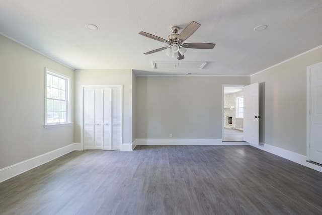 2019 Falling Leaf Ln, Valdosta, GA 31602 - spare room featuring dark wood-style floors, a ceiling fan, and crown molding