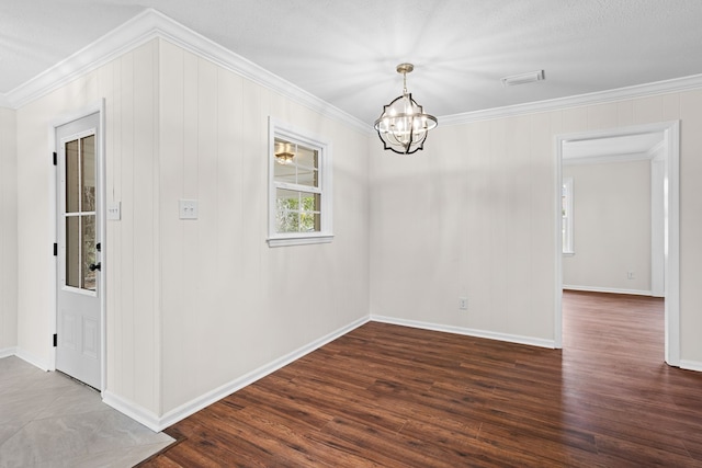 interior space with crown molding, visible vents, dark wood-type flooring, a chandelier, and baseboards