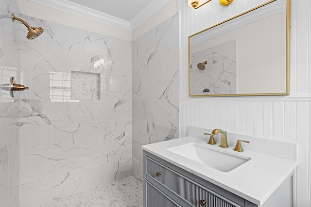 bathroom with crown molding, vanity, and a marble finish shower