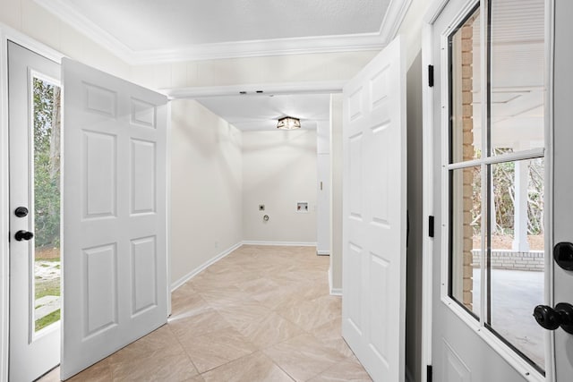 interior space featuring baseboards and crown molding