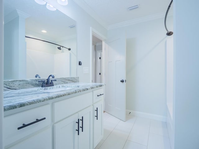 5674 Clydetta Dr, Lake Park, GA 31636 - bathroom with vanity, crown molding, tile patterned floors, baseboards, and bathtub / shower combination