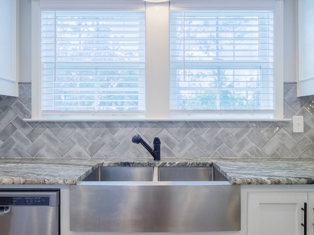 5674 Clydetta Dr, Lake Park, GA 31636 - kitchen with a sink, dishwasher, white cabinetry, and backsplash