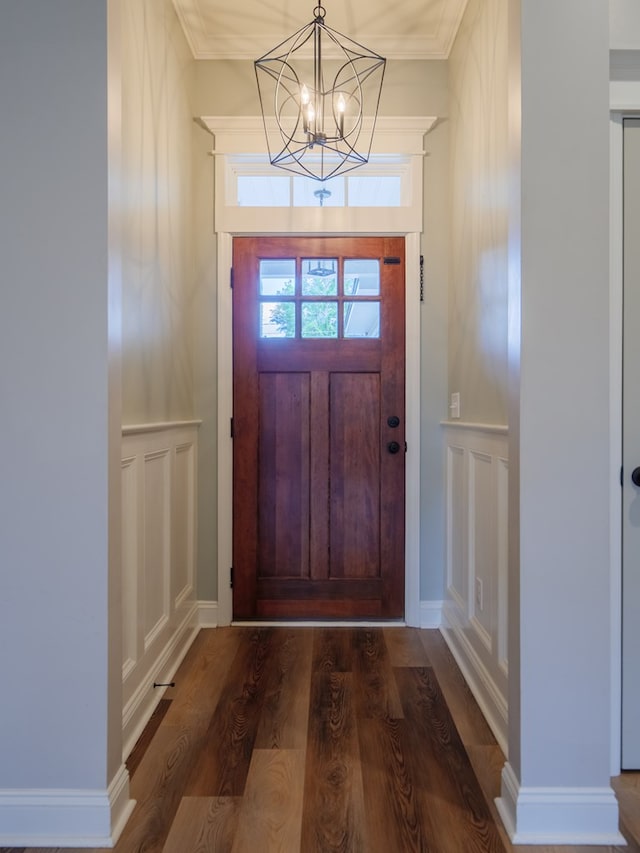 5674 Clydetta Dr, Lake Park, GA 31636 - entrance foyer with a decorative wall, a chandelier, wood finished floors, and wainscoting