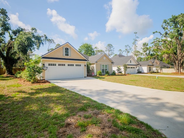5674 Clydetta Dr, Lake Park, GA 31636 - view of front of house with driveway, a front lawn, and a garage