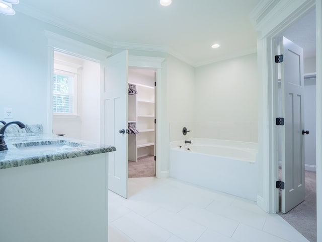 5674 Clydetta Dr, Lake Park, GA 31636 - full bathroom featuring a walk in closet, a garden tub, vanity, recessed lighting, and ornamental molding
