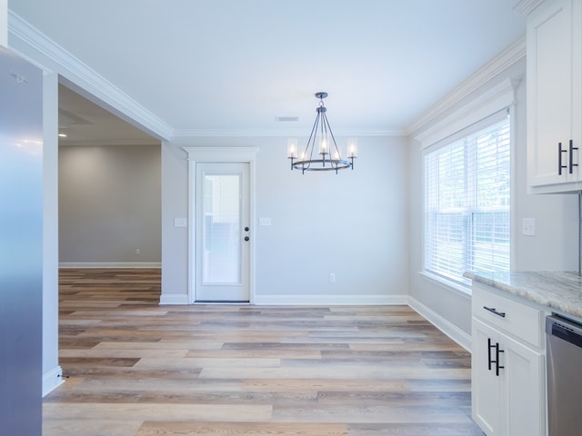 5674 Clydetta Dr, Lake Park, GA 31636 - unfurnished dining area featuring a chandelier, baseboards, light wood-style flooring, and crown molding