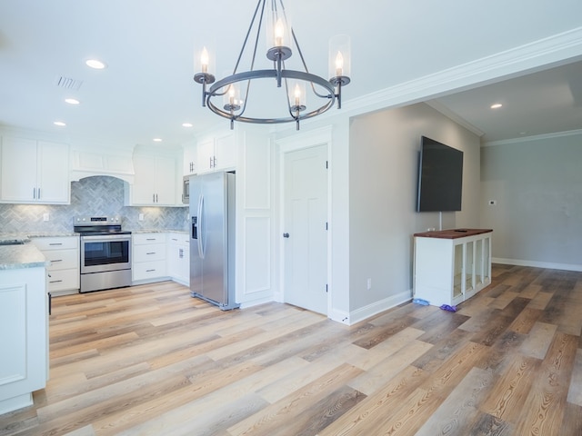 5674 Clydetta Dr, Lake Park, GA 31636 - kitchen featuring stainless steel appliances, a chandelier, crown molding, backsplash, and white cabinetry