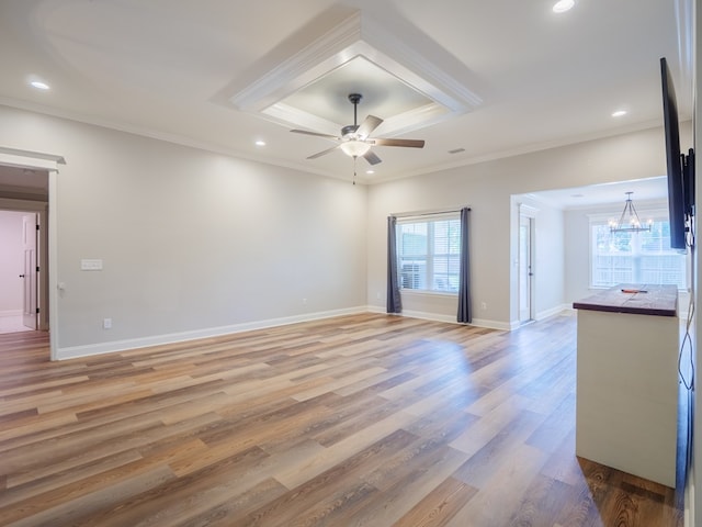 5674 Clydetta Dr, Lake Park, GA 31636 - unfurnished living room with ornamental molding, light wood-style flooring, a ceiling fan, a chandelier, and recessed lighting