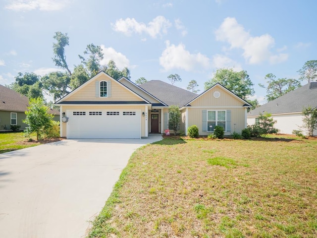 5674 Clydetta Dr, Lake Park, GA 31636 - view of front of house with an attached garage, driveway, and a front yard