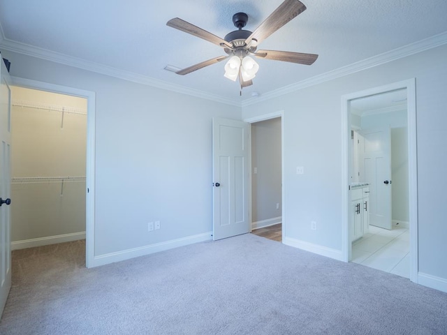 5674 Clydetta Dr, Lake Park, GA 31636 - unfurnished bedroom with carpet floors, a walk in closet, ornamental molding, baseboards, and a closet