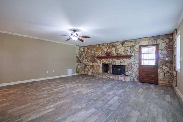 unfurnished living room featuring ceiling fan, wood-type flooring, and ornamental molding