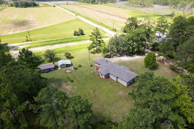 birds eye view of property with a rural view