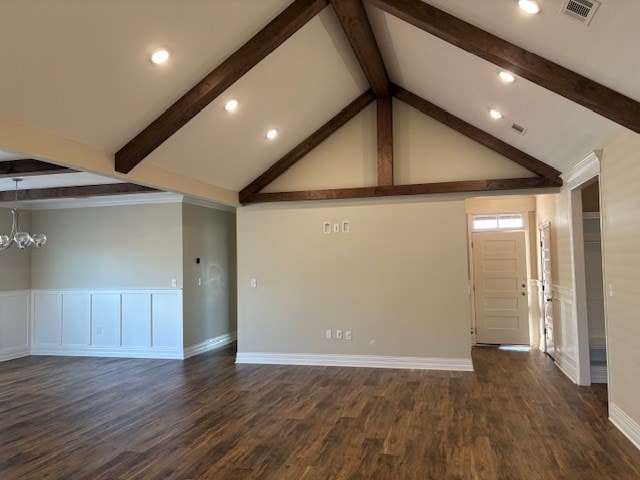 unfurnished living room featuring dark hardwood / wood-style floors, beam ceiling, high vaulted ceiling, and a notable chandelier