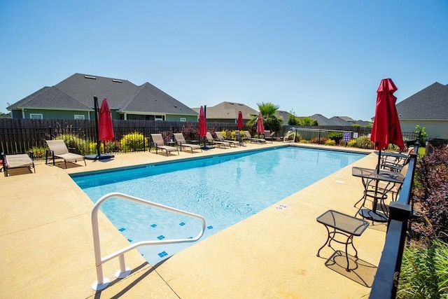 view of pool featuring a patio