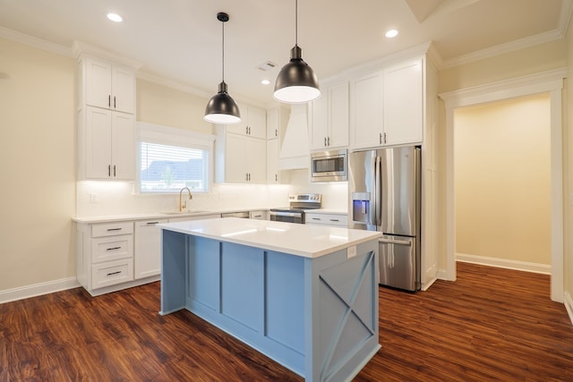 kitchen with stainless steel appliances, a kitchen island, a sink, white cabinets, and dark wood-style floors