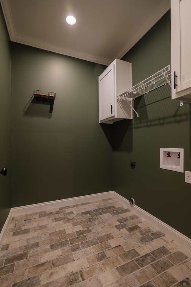 clothes washing area featuring hookup for a washing machine, cabinet space, ornamental molding, hookup for an electric dryer, and baseboards