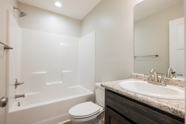 bathroom featuring  shower combination, recessed lighting, vanity, and toilet