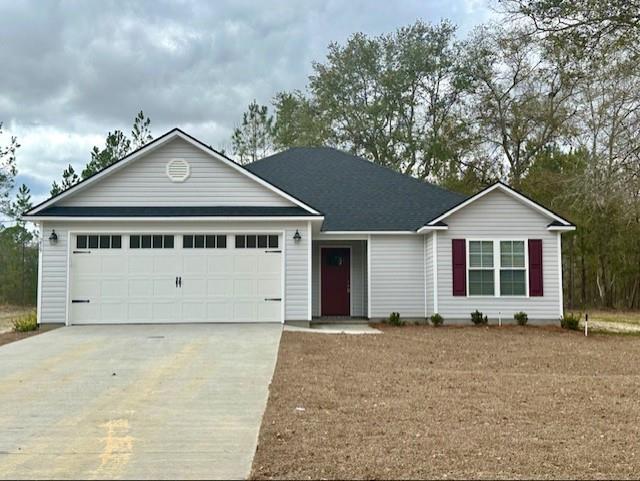 single story home with an attached garage and concrete driveway