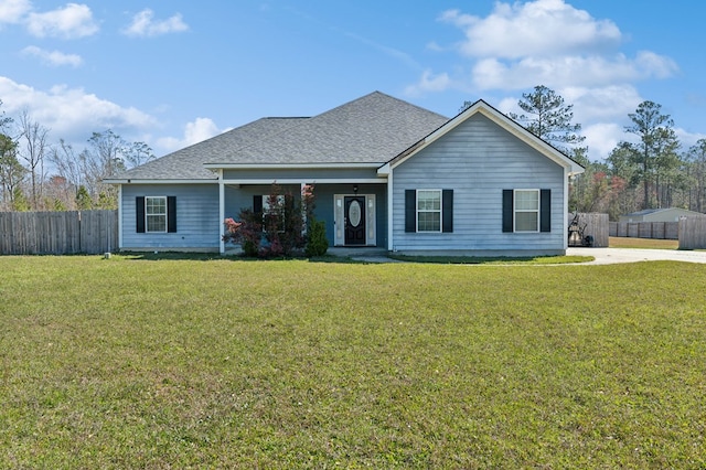 single story home with roof with shingles, a front lawn, and fence