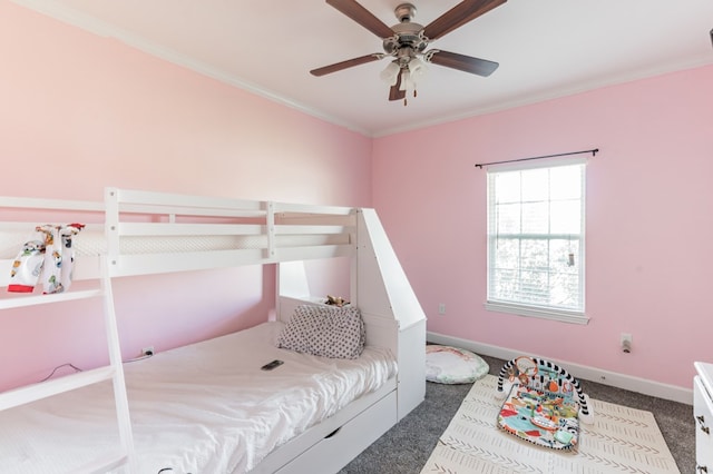 bedroom featuring baseboards, crown molding, and carpet