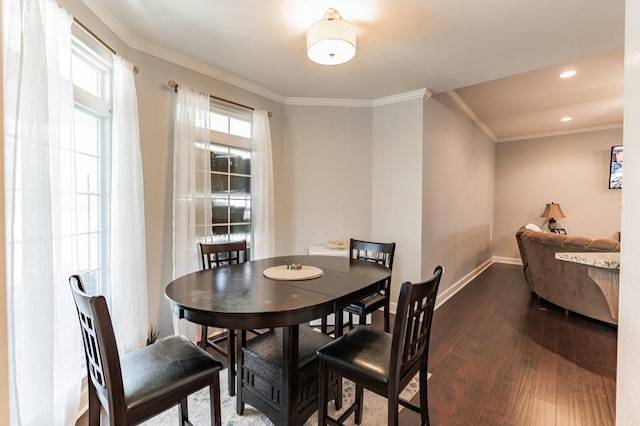 dining room with recessed lighting, baseboards, ornamental molding, and dark wood-style flooring