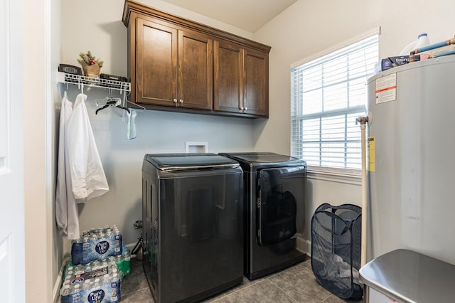 laundry area featuring cabinet space, independent washer and dryer, water heater, and tile patterned flooring