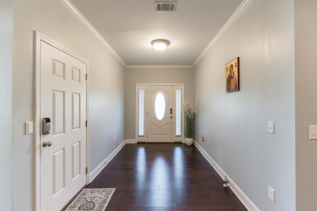 entrance foyer featuring baseboards, wood finished floors, visible vents, and ornamental molding