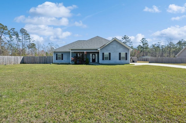 single story home with a front lawn and fence