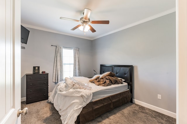 carpeted bedroom with crown molding, a ceiling fan, and baseboards