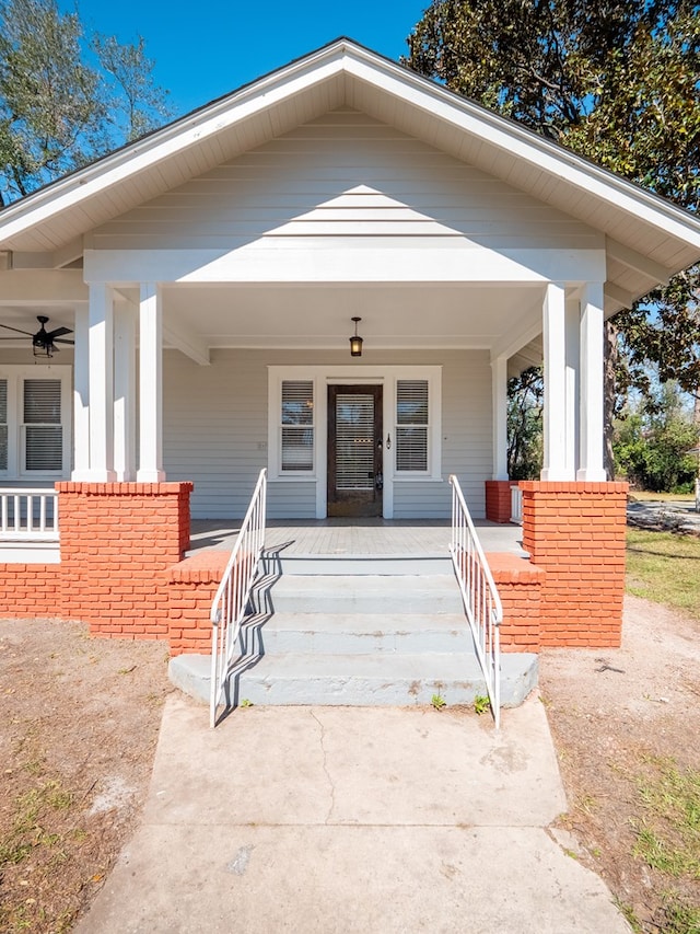 property entrance featuring a porch and ceiling fan