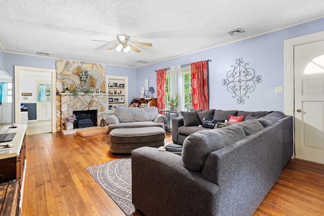 711 S Parrish Ave, Adel, GA 31620 - living area featuring visible vents, a ceiling fan, wood-type flooring, and a textured ceiling
