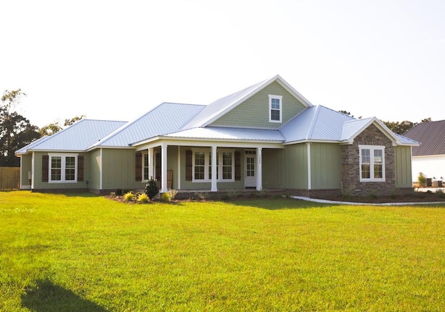 view of front of property featuring a front lawn and french doors