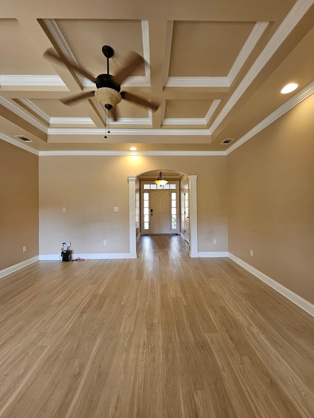 unfurnished living room featuring light hardwood / wood-style flooring, ceiling fan, crown molding, and coffered ceiling