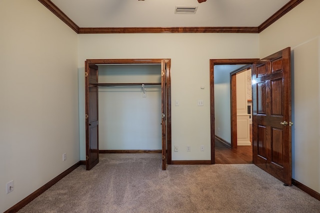 4849 Oak Arbor Dr, Valdosta, GA 31602 - unfurnished bedroom featuring crown molding, carpet floors, and a closet