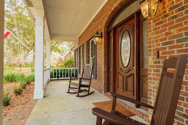 4849 Oak Arbor Dr, Valdosta, GA 31602 - property entrance featuring covered porch and brick siding