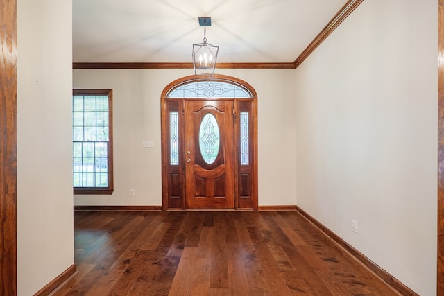 4849 Oak Arbor Dr, Valdosta, GA 31602 - entrance foyer featuring dark wood-style floors, a chandelier, and ornamental molding