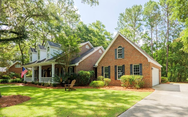 4849 Oak Arbor Dr, Valdosta, GA 31602 - traditional home with covered porch, brick siding, driveway, and a garage