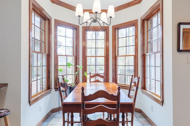 dining room featuring crown molding and an inviting chandelier