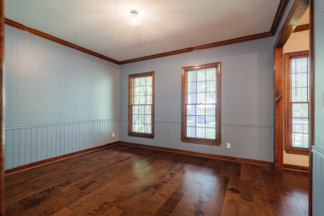 4849 Oak Arbor Dr, Valdosta, GA 31602 - spare room with hardwood / wood-style floors, ornamental molding, and a wainscoted wall