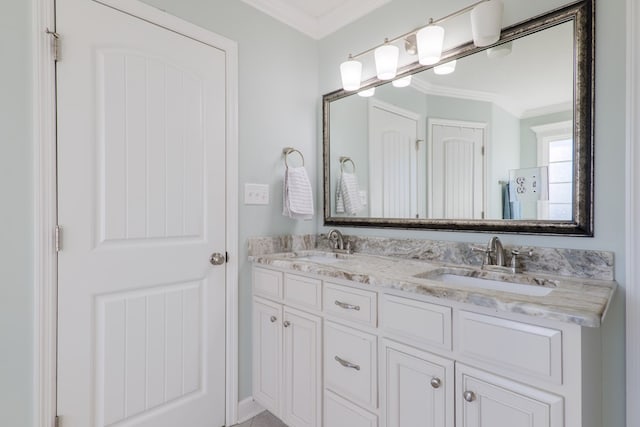 bathroom with vanity and ornamental molding